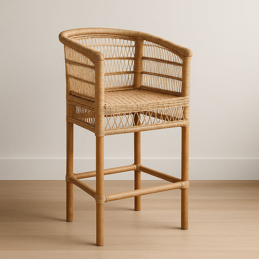 Natural woven bar chair with Malawian rattan craftsmanship and curved backrest, styled in a minimalist interior.
